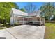 Charming home with a large, inviting wrap-around porch and a spacious concrete driveway at 2354 Hamilton St, Hampton, GA 30228