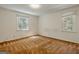 Bedroom with neutral walls, carpet, and two windows that allow for ample light at 395 Hood Ave, Fayetteville, GA 30214