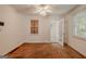Bedroom with neutral walls, carpet, ceiling fan and a view to another room at 395 Hood Ave, Fayetteville, GA 30214