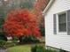 Charming home exterior featuring a vibrant Japanese maple tree at 395 Hood Ave, Fayetteville, GA 30214