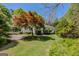 Exterior home view of a landscaped yard and car port at 395 Hood Ave, Fayetteville, GA 30214