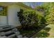 Landscaped yard with steps leading up to a white house with a charming exterior at 395 Hood Ave, Fayetteville, GA 30214
