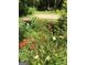 Garden area with colorful flowers and bird bath at 395 Hood Ave, Fayetteville, GA 30214