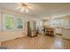 Eat-in kitchen with stainless steel refrigerator and classic cabinets, with natural light at 395 Hood Ave, Fayetteville, GA 30214