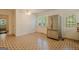 Eat-in kitchen area with stainless refrigerator, patterned flooring and view to the exterior at 395 Hood Ave, Fayetteville, GA 30214