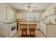 Bright kitchen with white appliances, butcher block countertops, and a cozy breakfast nook at 395 Hood Ave, Fayetteville, GA 30214