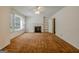 Bright living room featuring a fireplace, built-in shelving, and neutral-toned carpet at 395 Hood Ave, Fayetteville, GA 30214