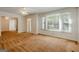 Spacious living area with large windows providing natural light and adjoining rooms at 395 Hood Ave, Fayetteville, GA 30214