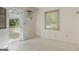 Mud room with glass door and window that provide bright natural light at 395 Hood Ave, Fayetteville, GA 30214