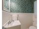 Charming half-bathroom with decorative wallpaper and vintage fixtures at 1325 E Forrest Ave, East Point, GA 30344