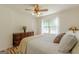 This comfortable bedroom with wood floor features a window view and a decorative dresser at 1325 E Forrest Ave, East Point, GA 30344