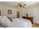 Bedroom features a warm color scheme, hardwood floors, and a traditional wooden dresser at 1325 E Forrest Ave, East Point, GA 30344