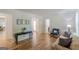 Open-concept living area with a stylish console table and easy access to other rooms at 1325 E Forrest Ave, East Point, GA 30344