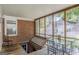 Enclosed porch with outdoor seating and a unique trap door to the basement at 1325 E Forrest Ave, East Point, GA 30344