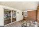 Covered porch overlooking a screened porch and the backyard at 1325 E Forrest Ave, East Point, GA 30344