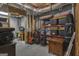 Basement featuring an open ceiling, concrete flooring and storage shelves and work desk at 1105 Astoria Ln, Peachtree City, GA 30269