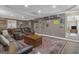 Finished basement with leather seating, an area rug, and decorative accents for a cozy atmosphere at 1105 Astoria Ln, Peachtree City, GA 30269
