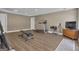 Spacious basement exercise room with wood floors, a treadmill, weights, and ample workout space at 1105 Astoria Ln, Peachtree City, GA 30269