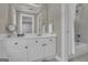 Well-lit bathroom with a vanity, mirror, and a shower/tub combo for a functional space at 1105 Astoria Ln, Peachtree City, GA 30269