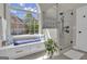 Bright bathroom showcasing a glass shower, window seat, and contemporary finishes at 1105 Astoria Ln, Peachtree City, GA 30269