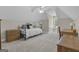 Cozy bedroom with sloped ceilings features a daybed, ceiling fan, and a window for natural light at 1105 Astoria Ln, Peachtree City, GA 30269