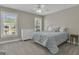 Bright, carpeted bedroom featuring two windows that offer abundant natural light for a warm ambiance at 1105 Astoria Ln, Peachtree City, GA 30269