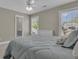 Bright bedroom featuring a serene view from the window and comfortable, cozy bedding at 1105 Astoria Ln, Peachtree City, GA 30269