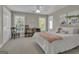 Inviting bedroom with ample natural light and a cozy bed, creating a warm and welcoming atmosphere at 1105 Astoria Ln, Peachtree City, GA 30269