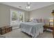 Comfortable bedroom with natural light from the window and stylish decor, offering a relaxing retreat at 1105 Astoria Ln, Peachtree City, GA 30269