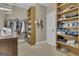 Large walk-in closet featuring custom wood shelving and ample storage space at 1105 Astoria Ln, Peachtree City, GA 30269