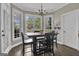 Cozy dining area featuring abundant natural light and stylish light fixture at 1105 Astoria Ln, Peachtree City, GA 30269