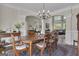 Charming dining room showcasing a wooden table, area rug, and an open layout at 1105 Astoria Ln, Peachtree City, GA 30269