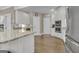 Bright kitchen features stainless appliances, white cabinets, and hardwood flooring at 1105 Astoria Ln, Peachtree City, GA 30269
