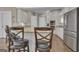 Eat-in kitchen with stainless steel appliances, custom cabinets and granite countertops at 1105 Astoria Ln, Peachtree City, GA 30269
