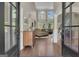 Grand foyer view into a living room boasting soaring ceilings, expansive windows, and hardwood flooring details at 1105 Astoria Ln, Peachtree City, GA 30269