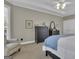 Spacious main bedroom with natural light, dark dresser set, and comfortable seating area at 1105 Astoria Ln, Peachtree City, GA 30269