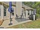 Inviting back patio with dining set, grilling area, and umbrella, ideal for outdoor entertaining at 49 Moss Cts, Palmetto, GA 30268