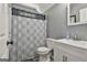Well-lit bathroom with shower and vanity at 49 Moss Cts, Palmetto, GA 30268