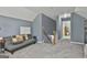 A bedroom space featuring vaulted ceilings, carpet, gray walls and stairs at 49 Moss Cts, Palmetto, GA 30268