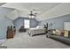 Spacious bedroom featuring vaulted ceilings, carpet, a window, and a seating area at 49 Moss Cts, Palmetto, GA 30268