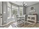 Bright breakfast nook features large windows, a chandelier, and stylish furniture at 49 Moss Cts, Palmetto, GA 30268