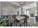 Dining room with open layout, wood flooring, and views into the living area at 49 Moss Cts, Palmetto, GA 30268