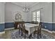 Bright dining room featuring a stylish chandelier and large windows at 49 Moss Cts, Palmetto, GA 30268