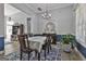 Dining room with dark wood furniture and blue accent wall at 49 Moss Cts, Palmetto, GA 30268