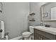 Clean half bathroom with modern fixtures, decorative shelves, stylish mirror, and vessel sink at 49 Moss Cts, Palmetto, GA 30268