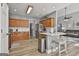 Well-lit kitchen featuring modern cabinets, stainless steel appliances, and an island with seating at 49 Moss Cts, Palmetto, GA 30268