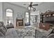 Bright living room features a cozy fireplace and comfortable seating at 49 Moss Cts, Palmetto, GA 30268