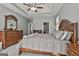 Comfortable main bedroom with a decorative wood bedframe, soft carpet, and neutral color scheme at 49 Moss Cts, Palmetto, GA 30268