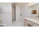 Bathroom features a tiled floor, vanity, and a mirror with lighting at 8289 Lake View Ter, Riverdale, GA 30274