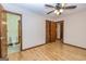 Comfortable bedroom with hardwood floors, closet, and access to the bathroom at 8289 Lake View Ter, Riverdale, GA 30274